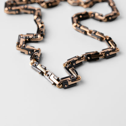 Luxury chain belt with rose gold and black design on a light gray background Baraka Cyborg Ceramic Chain GC245151ROCN Pre-Owned